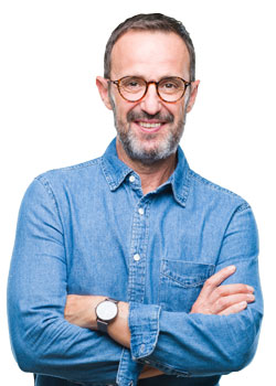 Middle aged entrepreneur with beard and glasses, smiling with arms folded across chest.